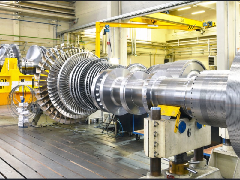 Industrial turbine machinery on a factory floor representing Afnan Global Imports consultancy services