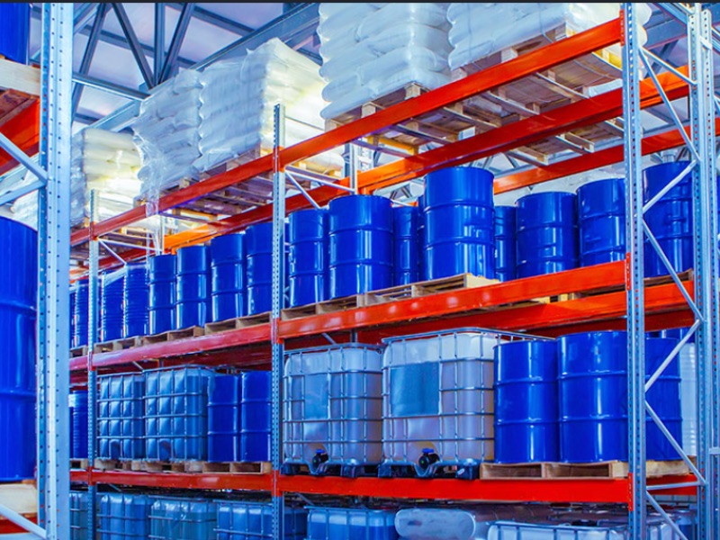 Warehouse stacked with drums and packaged goods for Afnan Global Imports trading operations